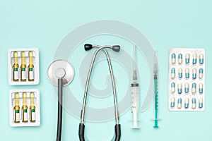 Flat lay of medical tools on colored background