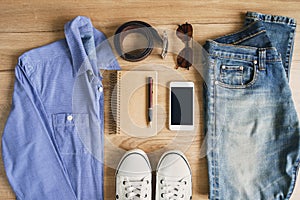 Flat lay of men casual fashion outfits on wooden background