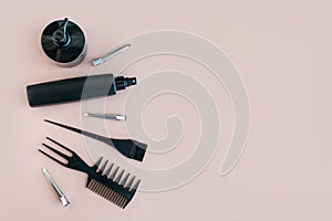 Flat lay Minimal composition with black hair salon tools on pastel background
