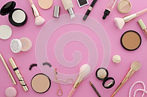 Flat lay mockup cosmetics. Make up products frame on a pink background