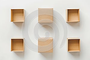 Flat lay Neatly arranged, diverse brown packages on white background.