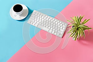 Flat lay Office desk table of modern workplace with laptop on blue and pimk background, top view laptop background and copy space