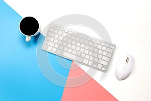 Flat lay Office desk table of modern workplace with laptop on blue pink and white background, top view laptop background and copy