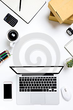 Flat lay Office desk table of modern workplace with laptop on white table, top view laptop background and copy space on white