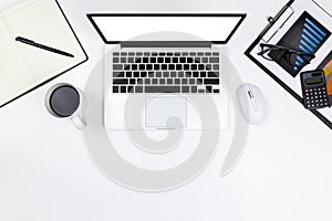 Flat lay Office desk table of modern workplace with laptop on white table, top view laptop background and copy space on white