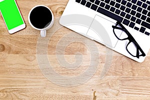 Flat lay Office desk table of modern workplace with laptop on wooden table, top view laptop background and copy space on wooden