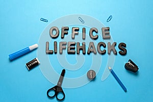 flat lay office supplies and inscription office lifehacks with black letters on a blue background