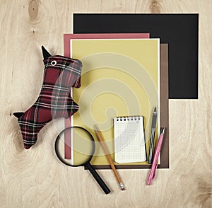 Flat lay office tools and supplies. Education background with stationery on wood. Flat design of creative office workspace, workpl