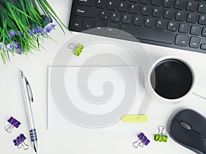 Flat lay office workspace desk with coffee,blank notebook, electronic devices and computer. organizer mockup concept for blog or