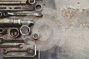 Flat lay Old hand tools ,Pliers screwdriver wrench rusted iron metal tools on Steel plate at garage