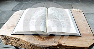 Flat lay open Bible, Greek New Testament. On wooden background. Baselland, Switzerland 12.05.2019