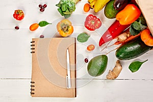 Flat lay paper shopping bag fresh vegetables and fruits, Shopping list food supermarket concept