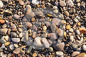 Flat lay of pebbles pattern on the sea shore