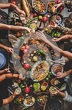 Flat-lay of people feasting with Turkish cuisine foods