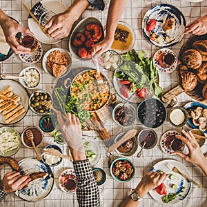 Flat-lay of family having traditional Turkish breakfast, square crop