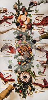 Flat-lay of Peoples hands with wine in glasses celebrating Christmas