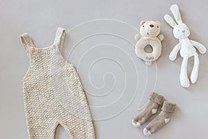 Flat lay photo of cute newborn baby accessories and bodysuit