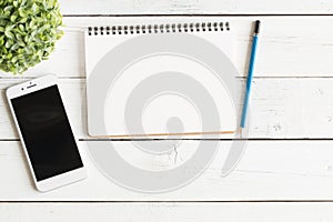 Flat lay photo of notebook and smartphone,Empty open notebook on