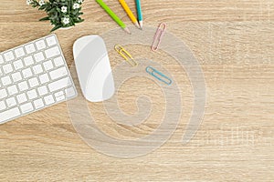 Flat lay photo of office desk with mouse and keyboard ,Top view workpace on wood table and copy space