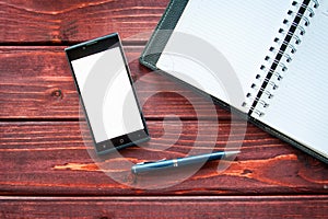 Flat lay photo of office desk with smartphone