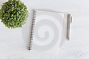 Flat lay photo of office desk on white background,empty notebook