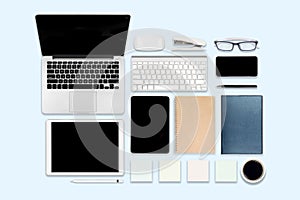 Flat lay photo of office table with laptop computer, digital tablet, mobile phone and accessories. on modern background. Desktop o