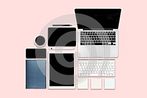 Flat lay photo of office table with laptop computer, digital tablet, mobile phone and accessories. on modern background. Desktop o