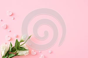 Flat lay photo of white spring flowers and hearts