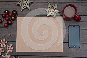 Flat lay photograph with blank sheet and christmas ornaments