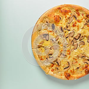 Flat lay photograph of tasty Italian pizza on rustic wooden board. Cheese and mushrooms.