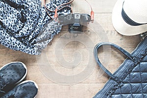 Flat lay photography with camera, travel accessories, essential