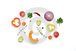 Flat lay pieces of a variety of vegetables on a white background, isolated. Top view