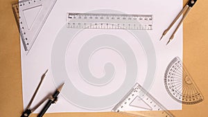 Flat lay of protractor compass set rulers