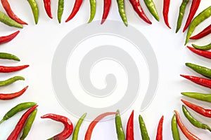 Flat lay red hot chillii peppers pattern isolated on white with clipping path. Red spicy chili peppers wallpaper pattern. Top view