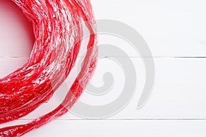 Flat lay red straw rope isolated on white background. top view