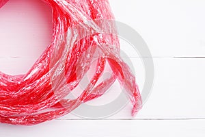 Flat lay red straw rope isolated on white background. top view