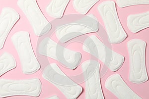 Flat lay with sanitary pads on pink background