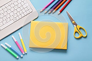 Flat lay. School Supplies. Book mockup, White Keyboard, School stationery on blue background. Back to school concept.