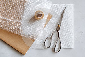 Flat Lay of Scissors, Bubble Wrap, and Craft Paper for Creative Packaging Mockup
