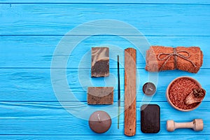 Flat lay set of brown stuff on blue wooden table.