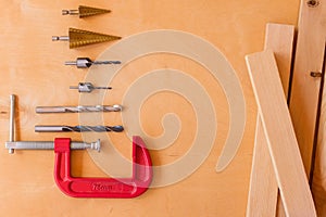 Flat lay of set of tools for concstruction works and home maintenance on wooden background. Top view