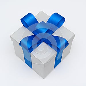 Flat lay silver gift box with blue satin bow ribbon on white background