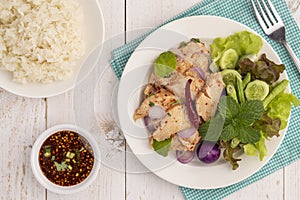 Flat lay sliced grilled chicken breast salad or nam tok gai n in Thai