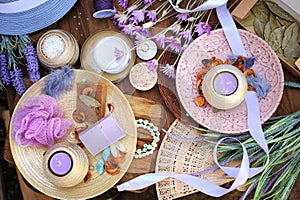 Flat lay spa accessories, handmade artisan soap, fresh flowers, wisp of bast, candles, bath salt photo