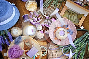Flat lay spa and fashion accessories, handmade artisan soap, fresh flowers, wisp of bast photo