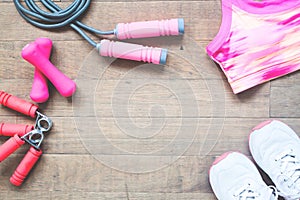 Flat lay of sport equipments and accessories for woman on wood background, Beauty and Healthy