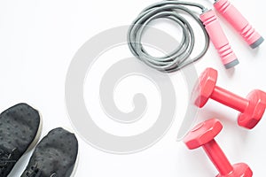 Flat lay of sport and fitness equipments on white background