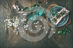 Flat-lay of Spring Easter Table setting with almond blossom flowers