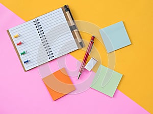 Flat Lay Stationary on Pink and yellow background