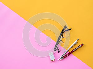 Flat Lay Stationary on Pink and yellow background